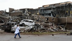 PHOTO: A nurse walks the destruction at Moore hospital after a huge tornado with winds of up to 200 miles per hour (320 kph) struck Moore, Oklahoma, near Oklahoma City, May 20, 2013.