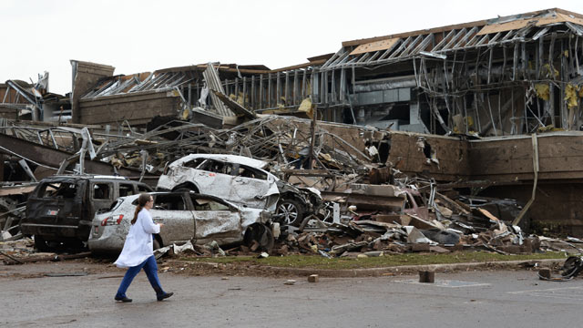 PHOTO: A nurse walks the destruction at Moore hospital after a huge tornado with winds of up to 200 miles per hour struck Moore, Okla., near Oklahoma City, May 20, 2013.