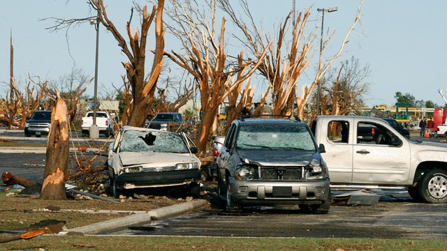 PHOTO: Cars and trees damaged by a tornado are seen at Canadian Valley Technology Center in El Reno, Okla. on June 1, 2013.