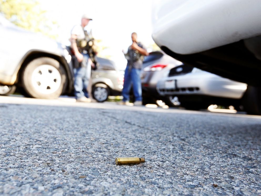 PHOTO: A spent cartridge lies on the ground as police officers secure the area after at least one person opened fire at a social services agency in San Bernardino, Calif., Dec. 2, 2015.
