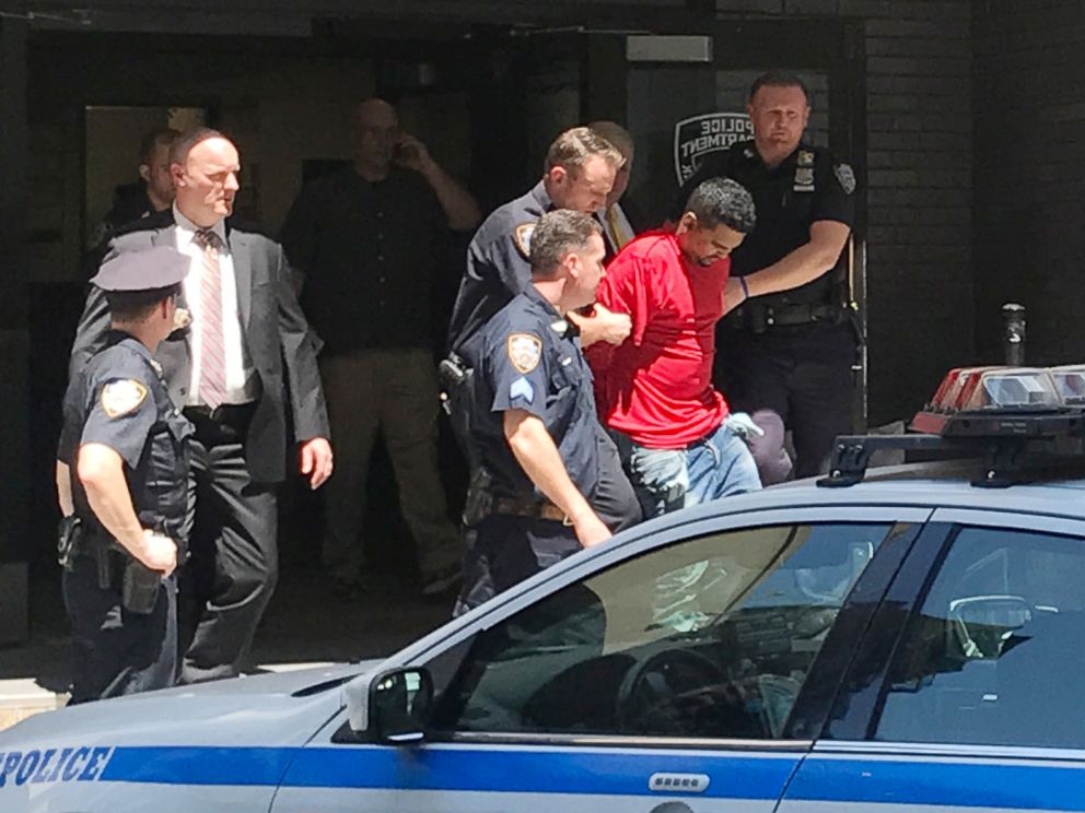 PHOTO: A man, who police said was the suspected driver of a car which crashed into a crowd on Times Square, is led out of the NYPD Midtown South precinct in New York, May 18, 2017.