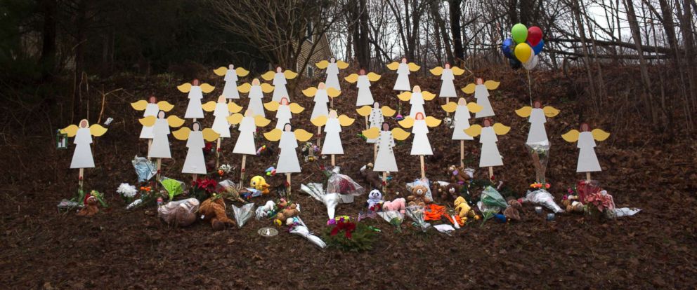 PHOTO: Twenty-seven wooden angel figures were placed in a wooded area beside the road in Sandy Hook after the mass shootings at Sandy Hook Elementary School, Newtown, Conn