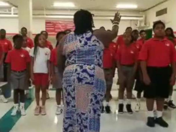 PHOTO: Choir Director Kenyatta Hardison leads her students through a choir rehearsal at the Cardinal Shehan School in Baltimore Maryland.