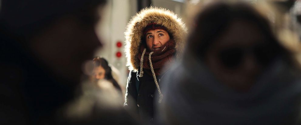 PHOTO: People walk through a frigid Manhattan, Dec. 28, 2017, in New York City. 