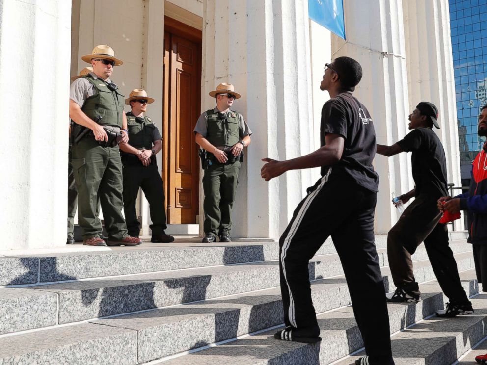 PHOTO: Protesters yell at law enforcement officers on the steps of the Old Courthouse following a verdict in the trial of former St. Louis police officer Jason Stockley in St. Louis on, Sept. 15, 2017.