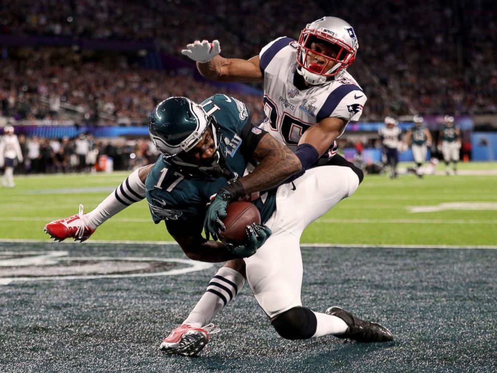 PHOTO: Alshon Jeffery, 17, of the Philadelphia Eagles catches a 34 yard pass, over Eric Rowe, 25, of the New England Patriots, for a touchdown during the first quarter in Super Bowl LII at U.S. Bank Stadium on Feb. 4, 2018 in Minneapolis.