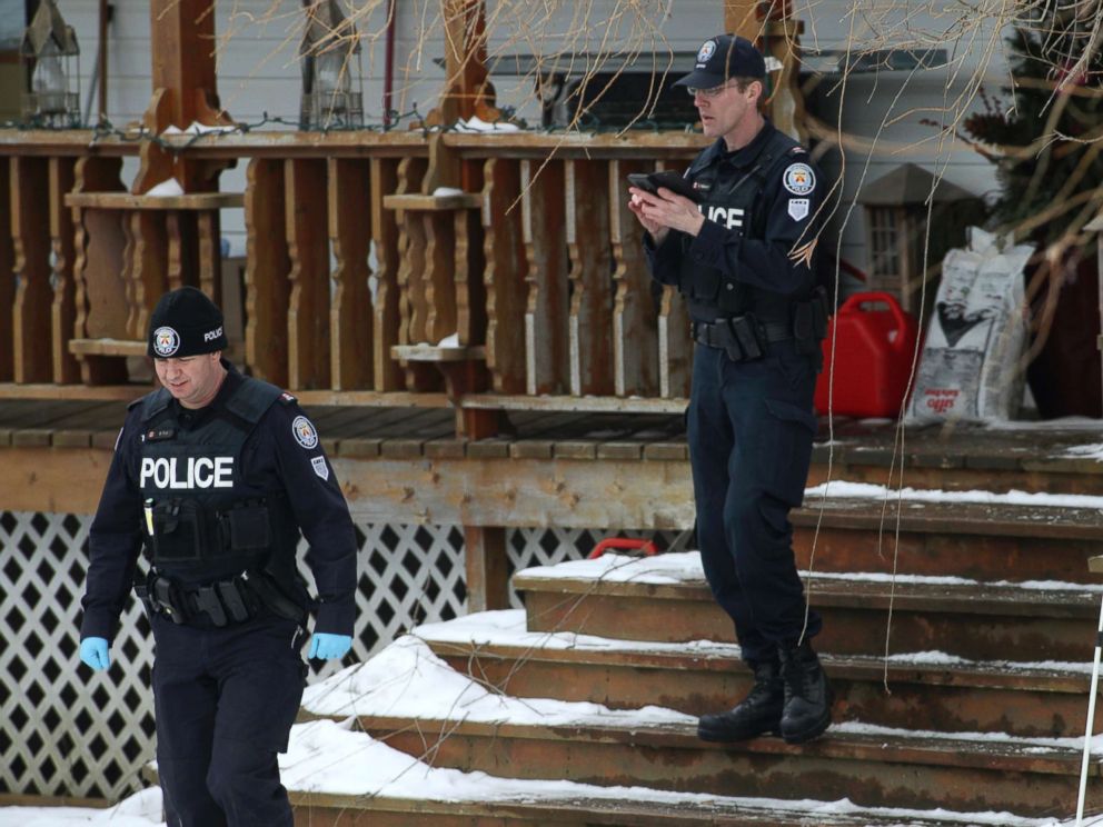 PHOTO: Toronto police forensic officers walk outside a house in Madoc, Ontario in this Jan. 19, 2018 file photo.