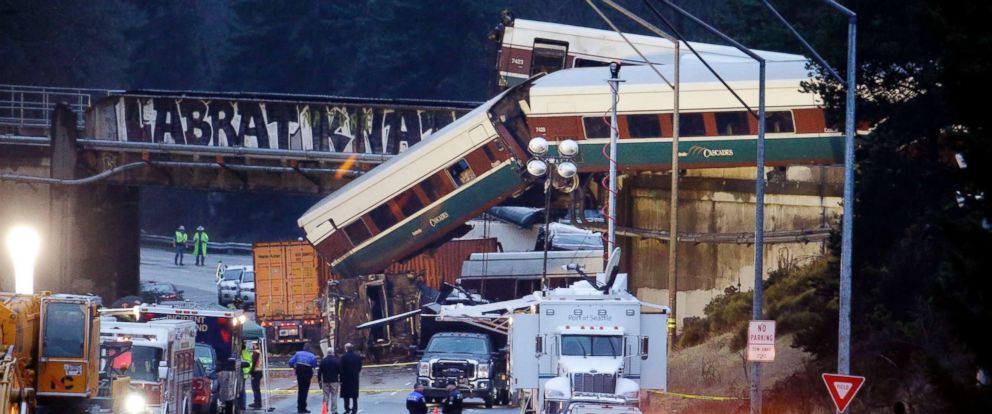 PHOTO: Lights illuminate cars from an Amtrak train that derailed above Interstate 5, Dec. 18, 2017, in DuPont, Wash. 