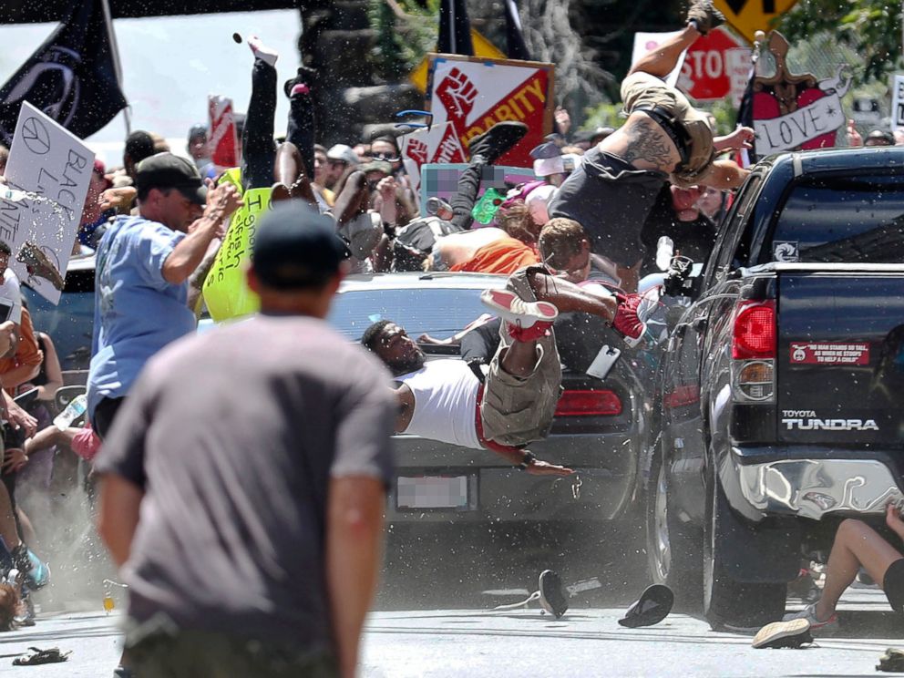 PHOTO: People fly into the air as a vehicle drives into a group of protesters demonstrating against a white nationalist rally in Charlottesville, Va., Aug. 12, 2017.