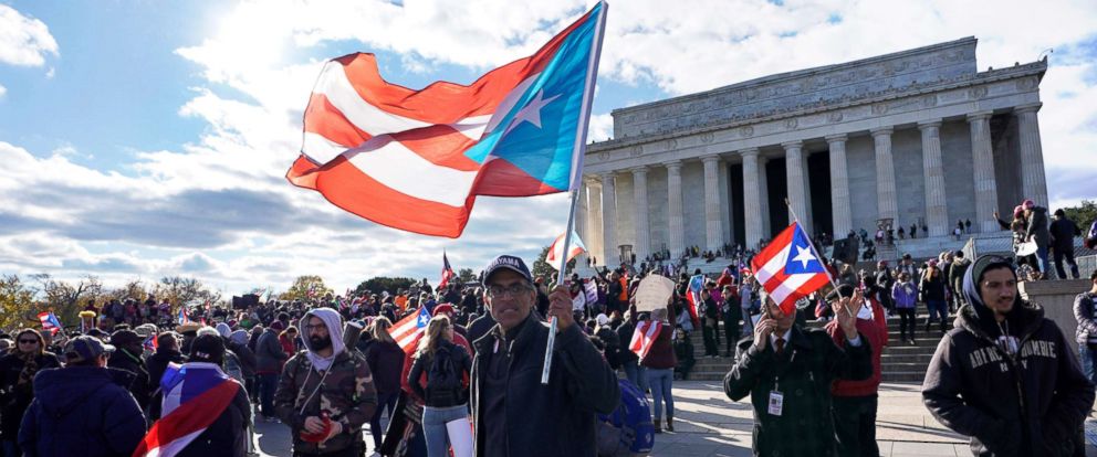 PHOTO: Members of the Hispanic Federation participate in the Unity March to highlight the ongoing humanitarian and natural disaster crisis in Puerto Rico, at the Lincoln Memorial in Washington, D.C., Nov. 19, 2017. 