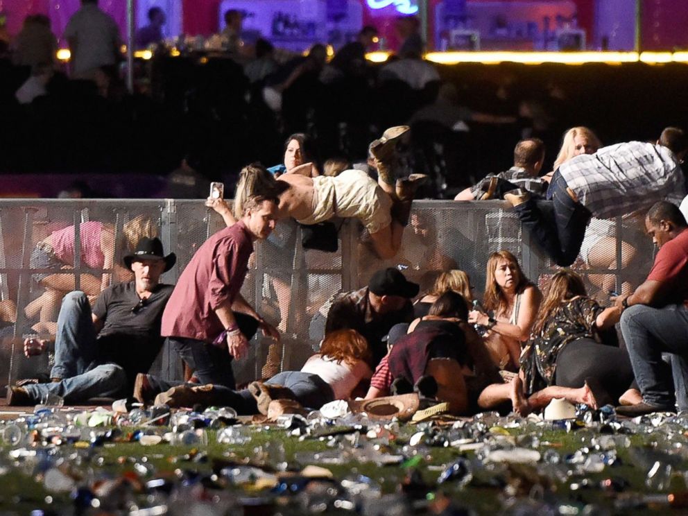 PHOTO: People scramble for shelter at the Route 91 Harvest country music festival, Oct. 1, 2017, in Las Vegas.