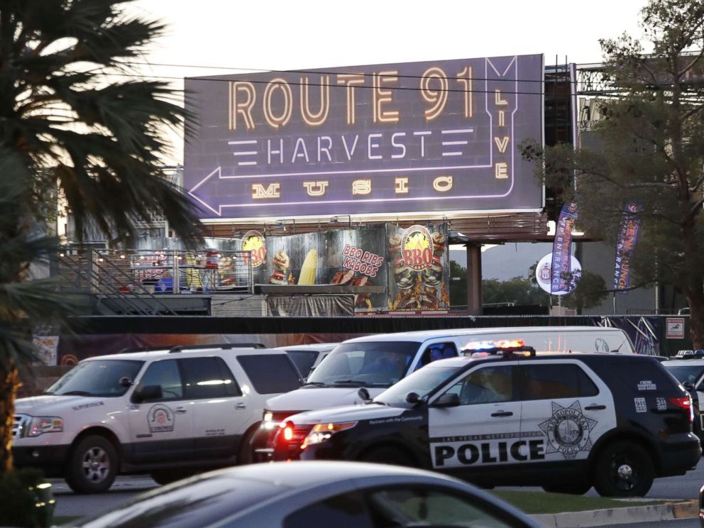 PHOTO: Las Vegas Metropolitan Police in front of a sign for the Route 91 Harvest festival near the scene of the mass shooting at the Route 91 Harvest festival on Las Vegas Boulevard in Las Vegas, Oct. 2, 2017.