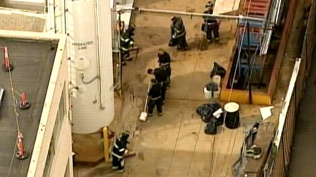 VIDEO: The man was pulled from the vat by co-workers after falling through a roof.