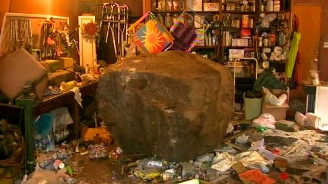 VIDEO: Large rock, loosened from hillside by a storm, landed in womans garage.