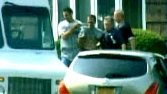 VIDEO: Two people were taken into custody in connection with pharmacy murders.