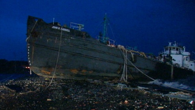 VIDEO: The storm surge moved a 170-foot-long tanker to land in Staten Island, New York.