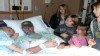 VIDEO: Mark Aulger held his newborn daughter before slipping into a coma.
