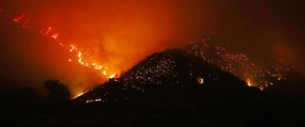 PHOTO: The Thomas Fire burns in the mountains, Dec. 6, 2017, near Ojai, Calif.
