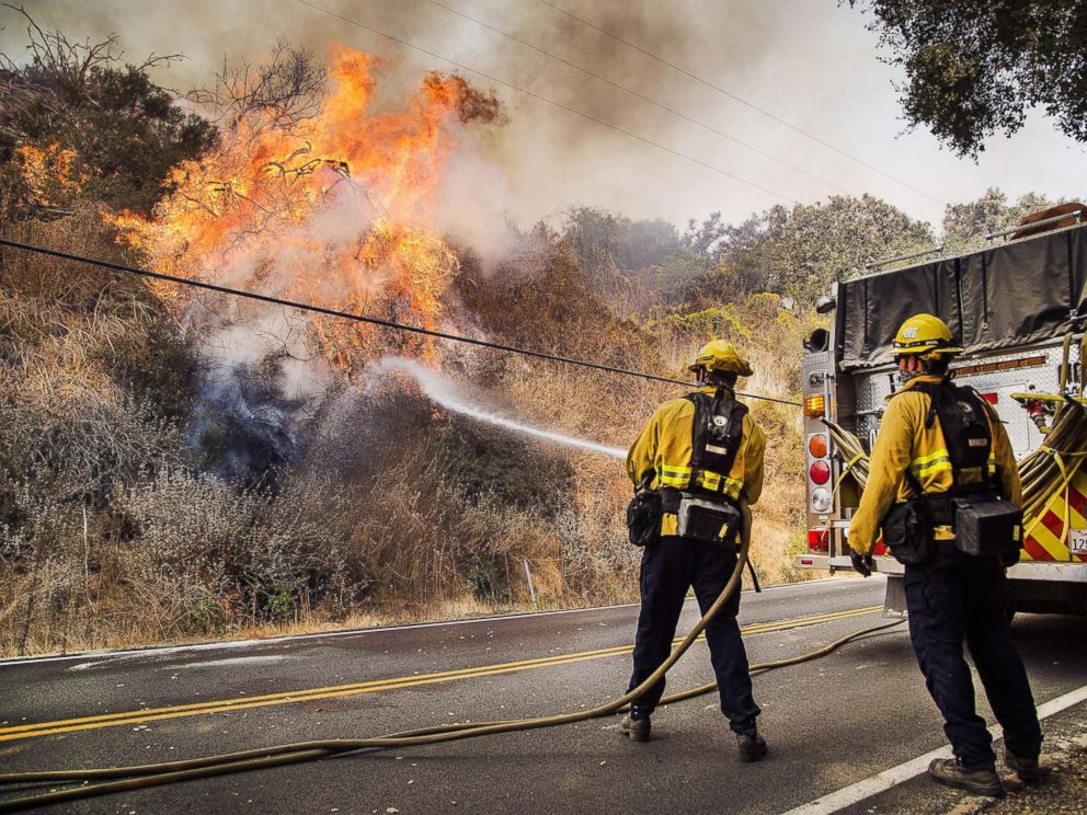 PHOTO: Firefighters battle flames on State Route 150 between Carpinteria and Ojai Calif., Dec. 11, 2017.