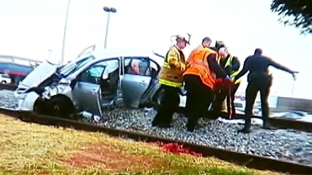 VIDEO: The pregnant drivers car flipped over before landing on railroad tracks in Georgia.