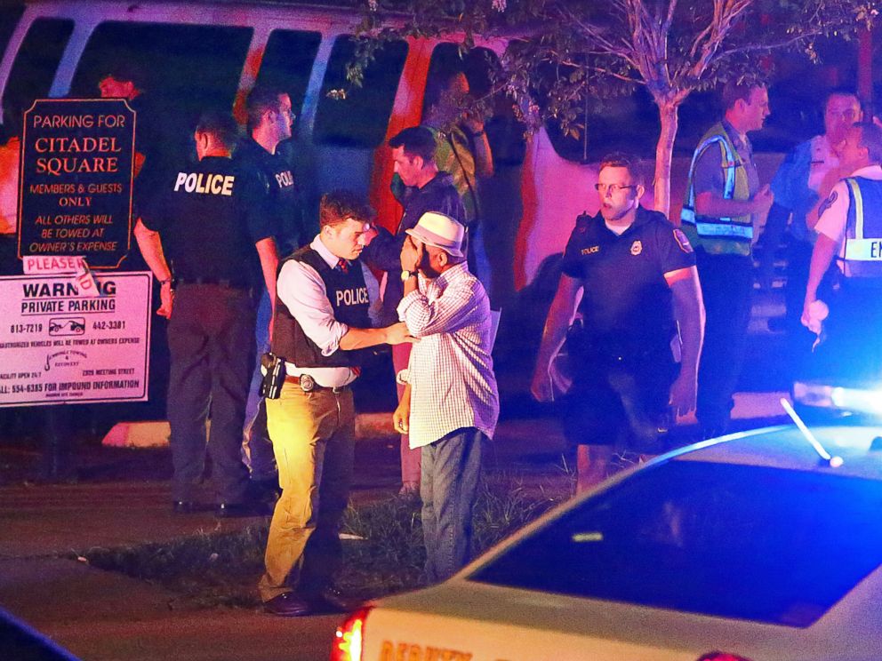 PHOTO: Police talk to a man outside the Emanuel AME Church following a shooting, June 17, 2015, in Charleston, S.C.