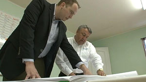 PHOTO: Marine John Raftery, left, started his own construction business with the help of an entrepreneurship program at Syracuse University.