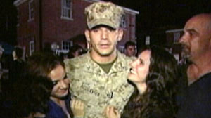 Photo: Soldier Reunited With His Family After Surviving Afghan Tour: U.S. Marine fulfills his World News wish to hug his sisters upon his arrival
