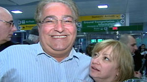 Anthony Naimoli is greeted by his wife, Randi, at John F. Kennedy Airport in New York, after returning from Haiti, where he had been missing for days after the earthquake.