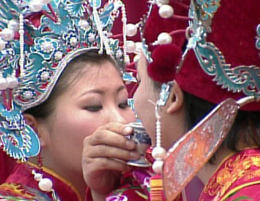During the Chinese wedding ritual the bride and groom exchange vows in the 