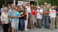 PHOTO Forrest Graves, center, with sunglasses, at the opening of his family-run business, JumpinGoat Coffee, in Helen, Ga.
