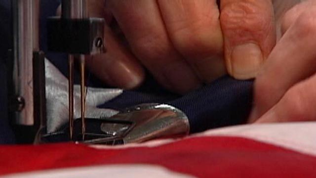 PHOTO:&nbsp;A factory worker at Annin Company in Ohio sews stars on an American flag in this undated file photo.