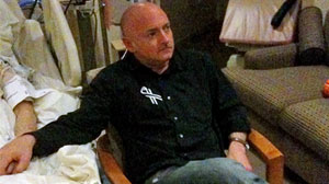 Photo: Astronaut Mark Kelly watches the State of the Union address at his wifes bedside