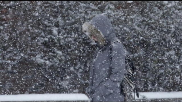 VIDEO: Ice, snow and dangerous conditions snarl traffic and cancel close to 3,000 flights.