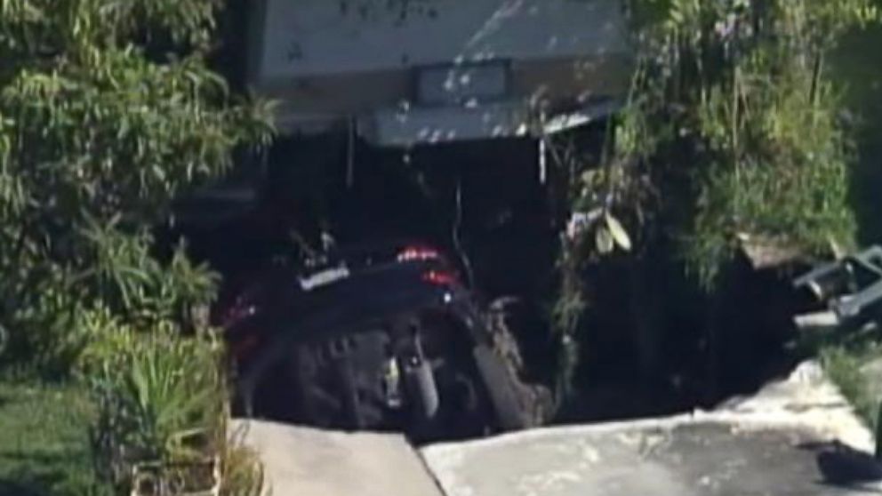 Massive Sinkhole In Florida Swallows Up Car And Driveway Video Abc News