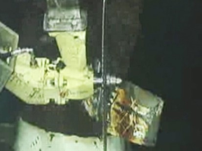 VIDEO: BP prepares to lower a containment dome in its latest bid to curb the spill.