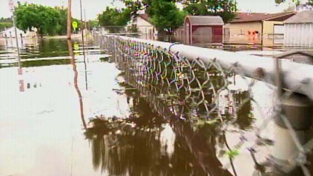 VIDEO: Rising river water breaks through levees, threatens homes and businesses.