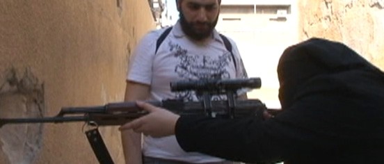 VIDEO: Behind the veil are women who are caught in the crisis carrying weapons