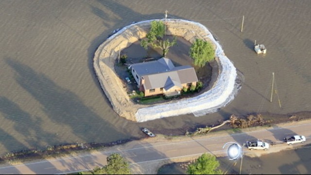VIDEO: Flood gates opened, residents protect themselves from high waters.