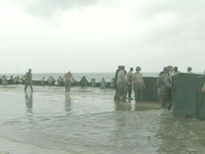 VIDEO: The National Guard is called in to save the island from the Gulf oil Spill.