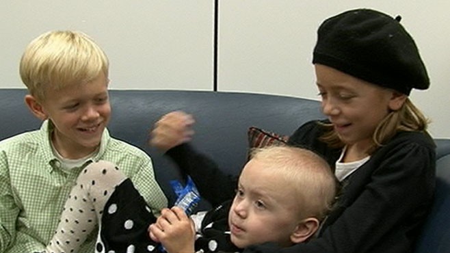 VIDEO: A young cancer survivor misses school to push for action against the disease.