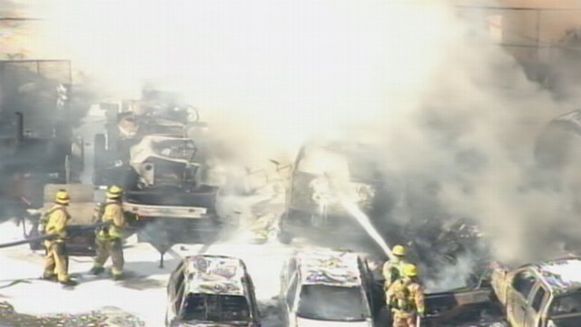 VIDEO: Firefighters rush to put out the flames.