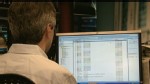 VIDEO: Companies inboxes across the globe are jammed with virus-attached emails.