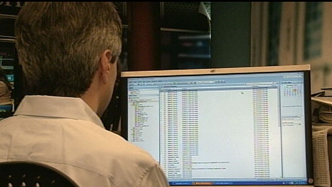 VIDEO: Companies inboxes across the globe are jammed with virus-attached emails.