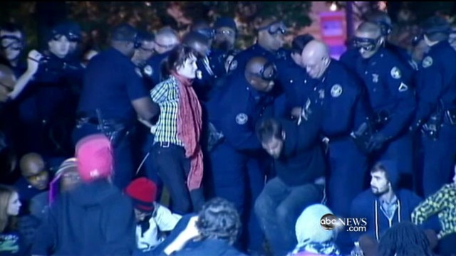 VIDEO: U.S. cities facing budget crises clamp down on protesters.