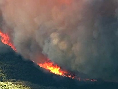 Sam Champion reports from the scene on the raging fires.