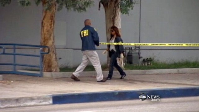 VIDEO: Woman assists in bank heist, believing a pipe bomb was strapped to her.