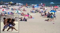 PHOTO With cameras wrapped  in beach blankets and audio equipment stowed in coolers, the "What Would You Do" team set out to explore how innocent bystanders would react to a theft 