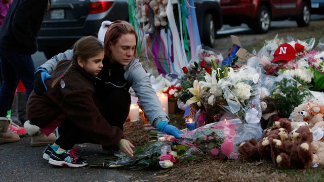 PHOTO:  Mourners gather for a candlelight vigil at Ram's Pasture to remember shooting victims, Saturday, Dec. 15, 2012 in Newtown, Conn.