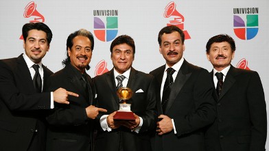 PHOTO: Los Tigres Del Norte pose with their award during the 12th annual Latin Grammy Awards at the Mandalay Bay Hotel and Casino Event Center in Las Vegas, Nevada on November 10, 2011.
