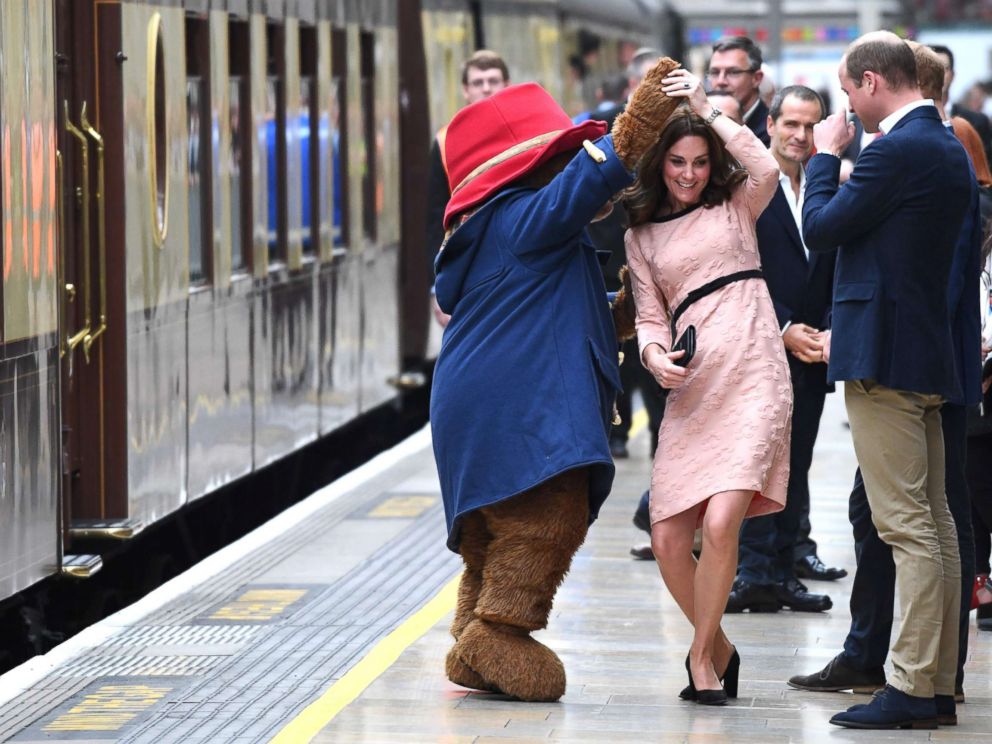 PHOTO: Britains Catherine, Duchess of Cambridge, dances with a person in a Paddington Bear outfit by her husband Britains Prince William, Duke of Cambridge as they attend a charities forum event at Paddington train station in London, Oct. 16, 2017.
